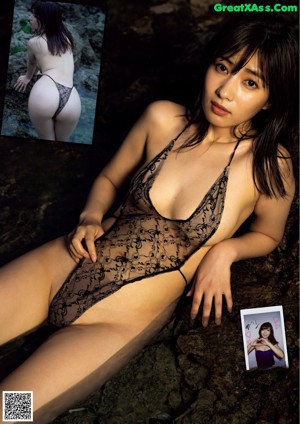 a woman in a white and blue bathing suit posing for the camera