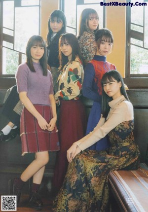 A group of young women sitting in a church.